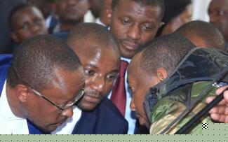 Nairobi Governor Mike Mbuvi Sonko (right) consults his lawyers at Milimani anti-corruption court when he pleaded not guilty to corruption charges on Monday. [George Njunge, Standard]